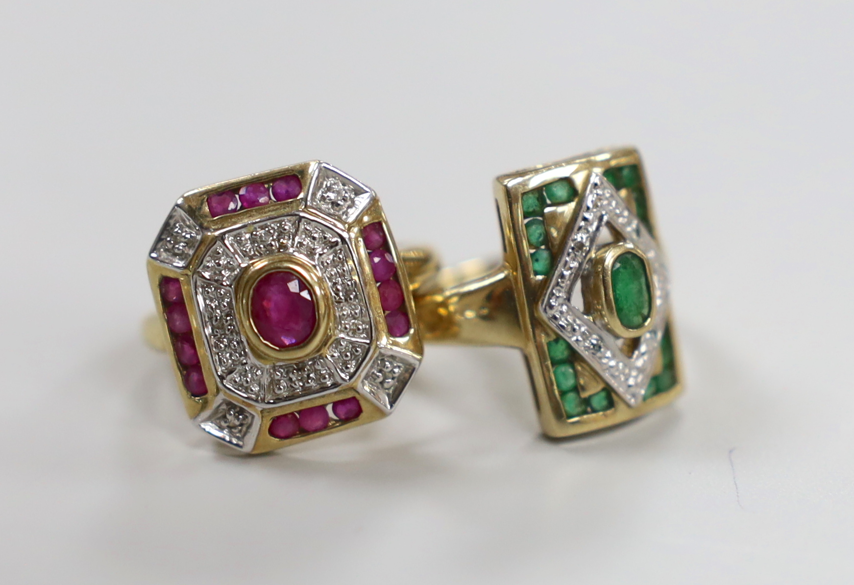 A modern 9ct gold, emerald and diamond chip cluster set table ring, size N and a similar ruby and diamond chip cluster set ring, gross weight 7.7 grams.